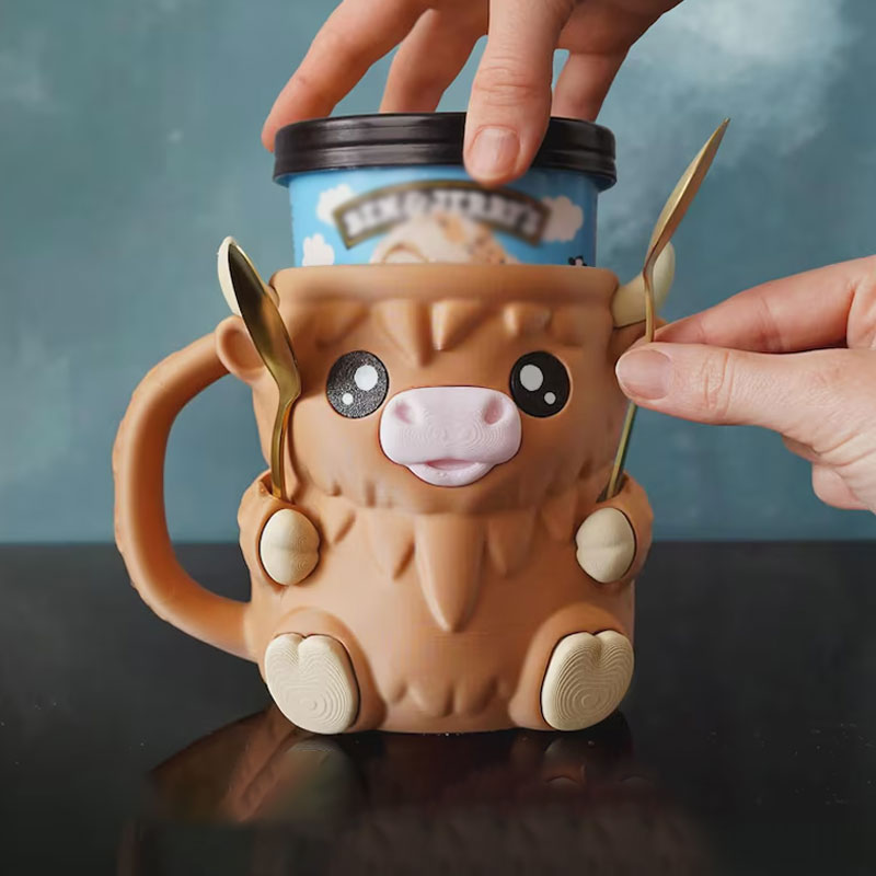 MooMelt™ – Le Support à Gobelet de Glace de la Petite Vache des Hautes Terres
